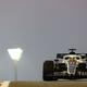 A photo of Nyck de Vries driving an Alpha Tauri F1 car in Abu Dhabi.